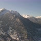 Air footage with a drone of a mountain full of snow. Mountains and trees, winter. - VideoHive Item for Sale