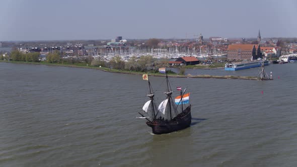 Halve Maen replica VOC ship sets sail from Hoorn, Holland; aerial pan