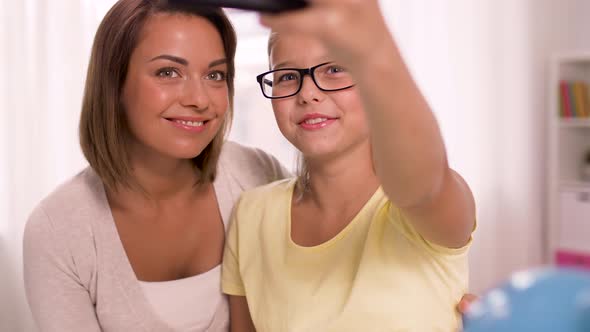 Happy Family Taking Selfie By Smartphone at Home 21