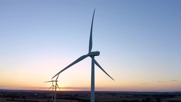 Aerial, drone. energy producing wind turbines. wind energy farm generating electricity. 