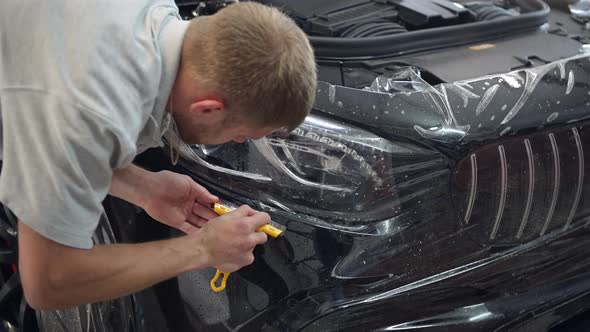 Close Up of Paint Protection Film Installation on Modern Luxury Car