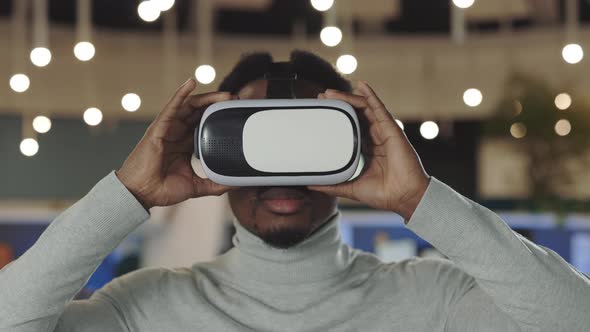 Office Male Worker Wearing a VR Headset Virtual Reality Concept