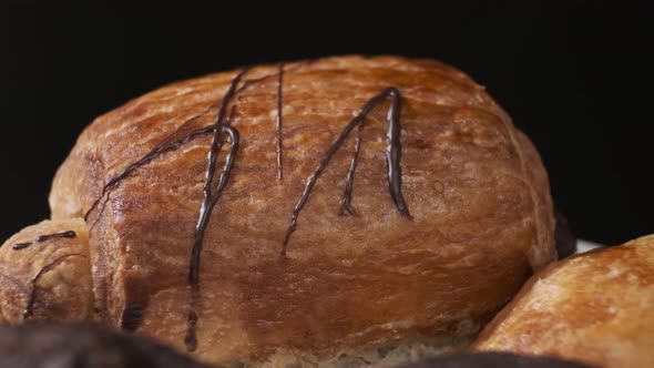 Various types of cakes on white plate rotating in front of camera, Close-up rotates view of Sweets