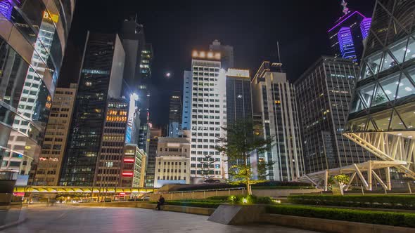 Night View Hyperlapse of Modern City Traffic Across Street with Skyscrapers