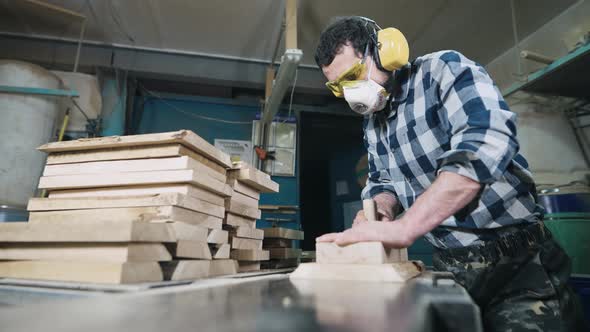 A Man Works with a Planer