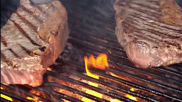 Steak on grill. Grilling on fire meat