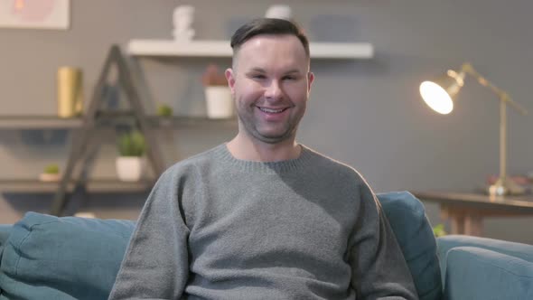 Portrait of Casual Man Shaking Head As Yes Sign