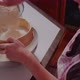 Woman Sifts Flour Through Sieve in the Kitchen While Baking Croissants - VideoHive Item for Sale