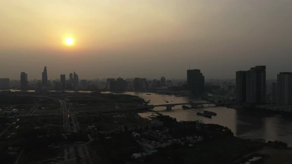 Drone shot of Saigon river smoggy sunset typical of a day with an extreme air pollution reading in S