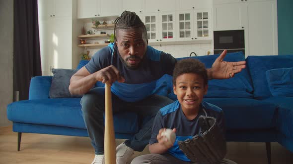 Excited Family Baseball Fans Watching Baseball on Tv and Celebrating Victory