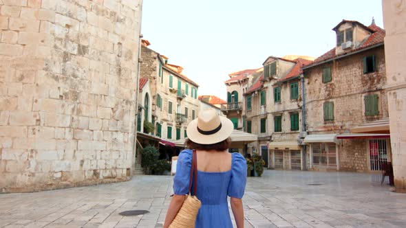 Young girl in a hat in the city on vacation. Croatia, Split