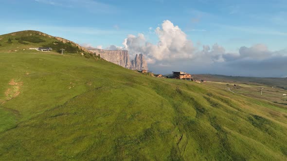 Dolomites mountains peaks with a hiking path on a summer sunrise