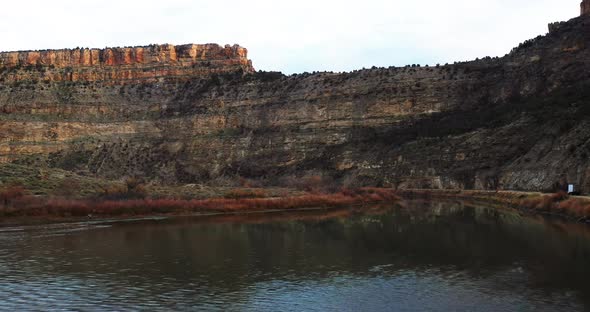 Drone video over Colorado River with Colorado butte in background.