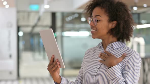 African Businesswoman Doing Video Call on Digital Tablet 