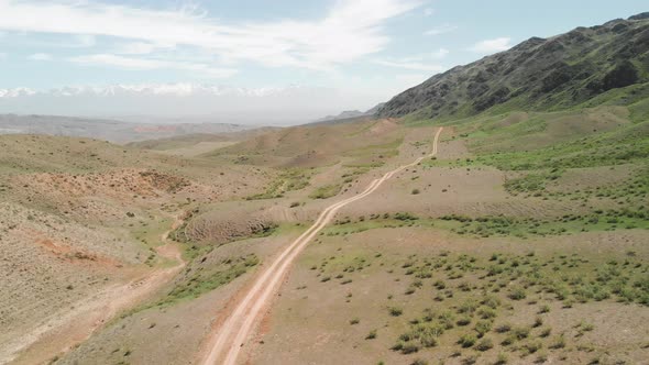 Aerial Drone Shot of the Country Road in the Mountains of Kazakhstan