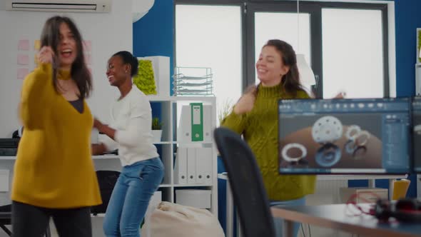 Multiethnic Happy Women Dancing Cheerfully in Startup Business Office