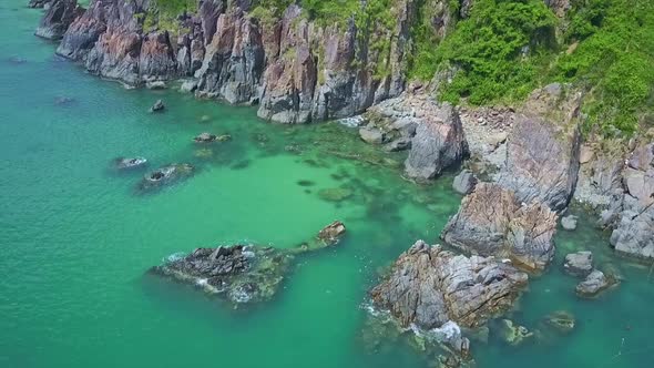 Aerial View Wonderful Azure Bay with Large Steep Cliffs