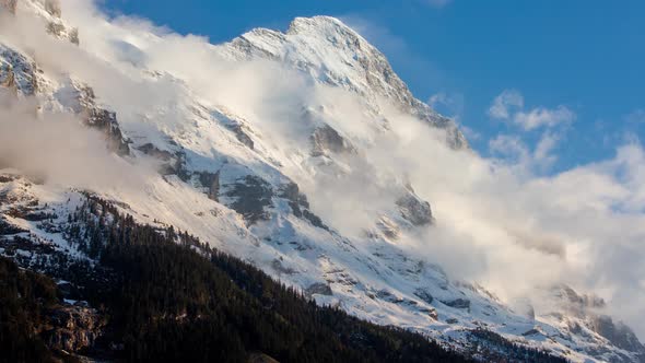 timelapse of clouds at the Eiger North Face in Grindelwald, Switzerland, after a fresh snow fall at