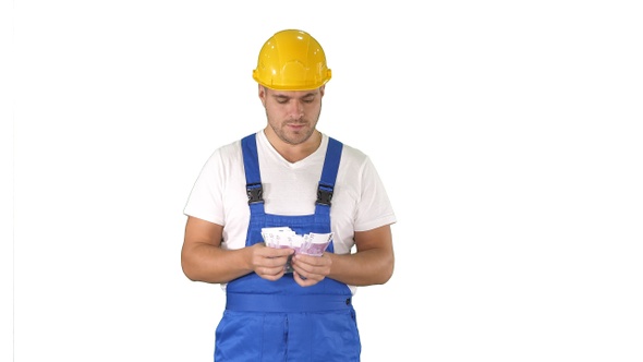 A workman excitedly counting his salary on white background.
