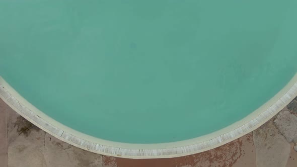 Three Children Are Diving Into Round Swimming Pool