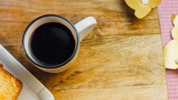 Cup of Coffee on the Table Where There is a Chocolate Cake