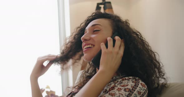 Woman talking on the phone, laughing