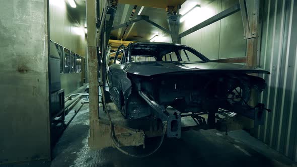 Unfinished Body of a Car Is Getting Mechanically Transported