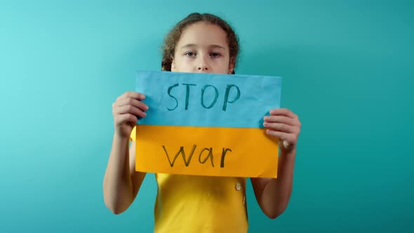 Upset Ukrainian Poor Toddler Scared Girl Kid Homeless Protesting War Conflict Raises Banner with