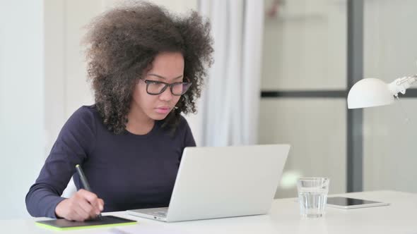 African Woman Unable to Write on Paper at Work