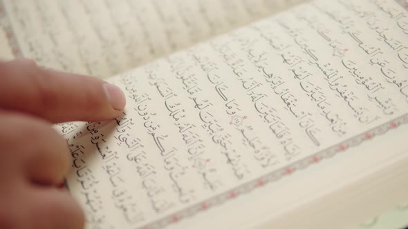 Man Praying Reading Koran Closeup Islamic Religion