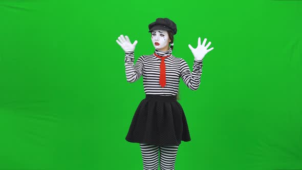 Mime Woman Is Putting Hands on Invisible Glass. Chroma Key