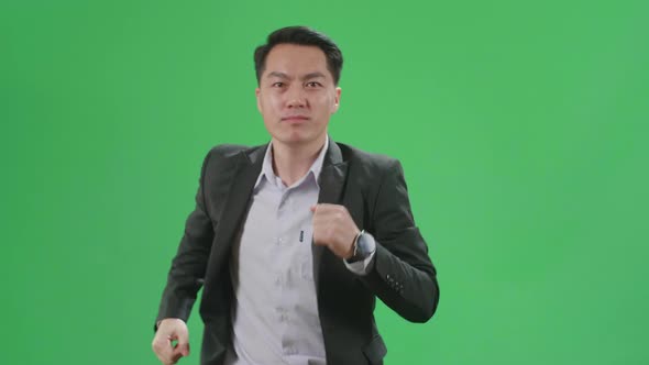 Asian Business Man Running On Green Screen Chroma Key