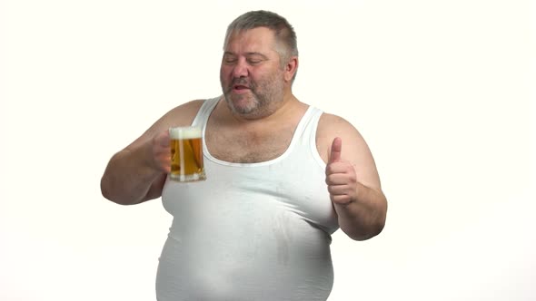 Overweight Mature Man with Beer Giving Thumb Up