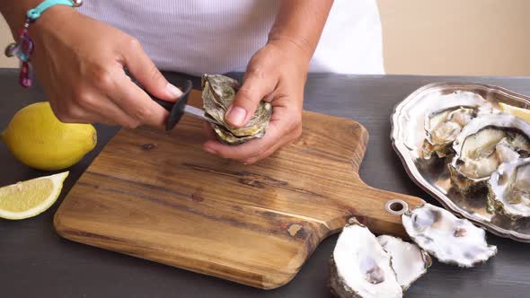 Squizing Lemon on Raw Oysters