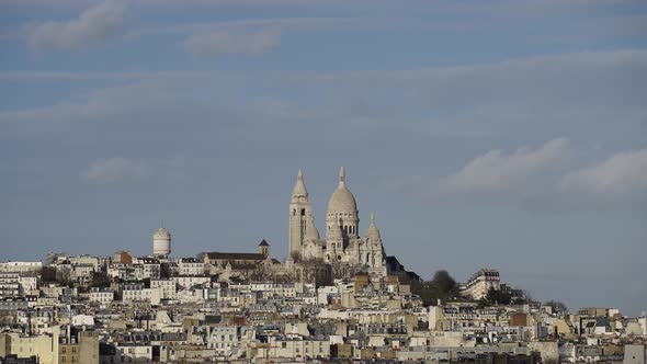 Bird flying in front of Sacre Coeur in Montmartre Paris France telephoto shot Slow Motion 4k 30p