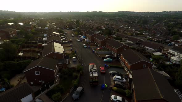 Aerial View, footage of Dustmen putting recycling waste into a garbage truck, Bin men, refuse collec