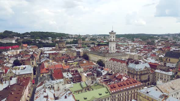 Flight Over Roofs, Streets. Aerial Drone Video of City Lviv, Ukraine. Market Square and the Central