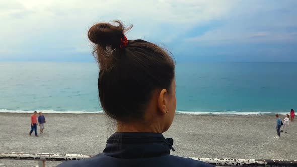 Young Female Looking Sadly at People on Seashore Beach, Depression, Freedom