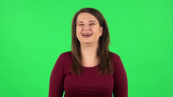 Portrait of Pretty Girl Bursting with Laughter Being in Positive. Green Screen