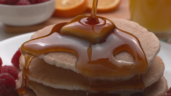 Syrup pouring onto stack of pancakes in super slow motion, shot on Phantom Flex 4K