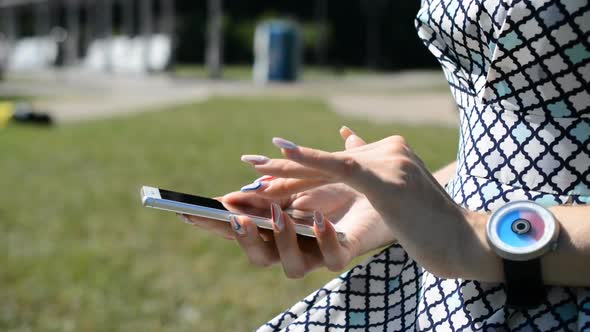 Woman Hands Typing Message on Black Smartphone