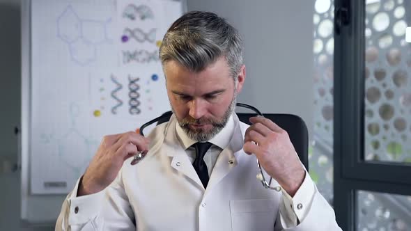 Portrait of Confident Doctor with Stethoscope in Private Clinic