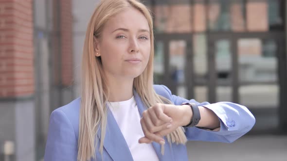 Waiting Young Businesswoman Checking Time on Watch