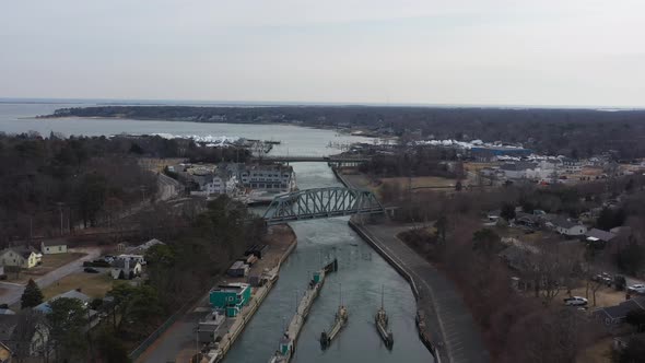 An aerial view over the Shinnecock Canal in Hampton Bays, Long Island, NY. The drone camera dolly in