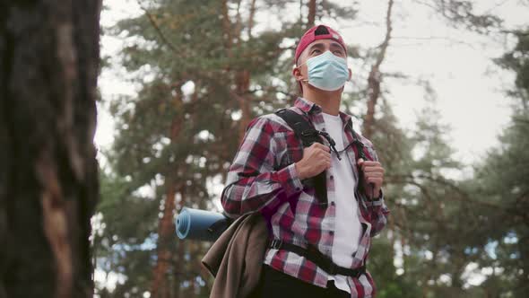 Young Asian Korean Tourist Man in Forest Wearing Medical Protective Mask Safe Travel Hiking in Park