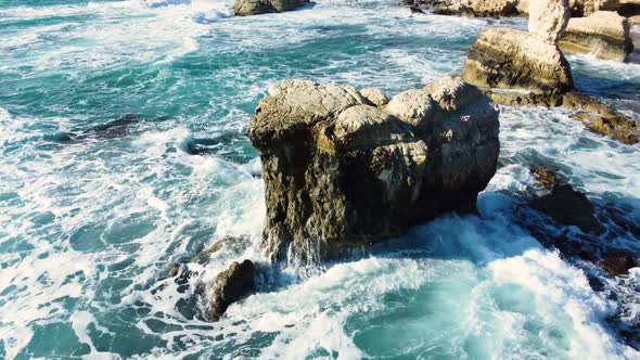 Ocean Waves Breaking on Rocks at Coast Aerial View Seashore in Stormy and Sunny Weather Cyprus
