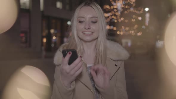 Young Lady Buys Perfect Christmas Present - In Slowmotion and Ungraded