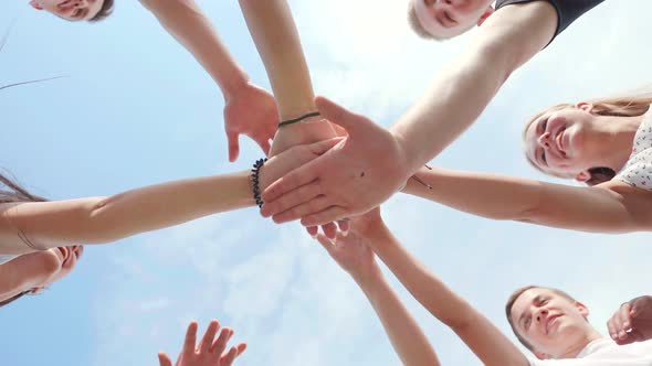 Friendly Friends Clasp Hands As a Sign of Strong Friendship and Teamwork.