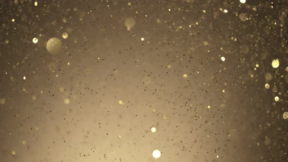 Super Slow Motion Shot of Golden Glitter Background at 1000Fps