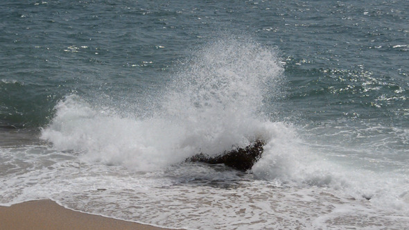 Water Smashses into Rocks